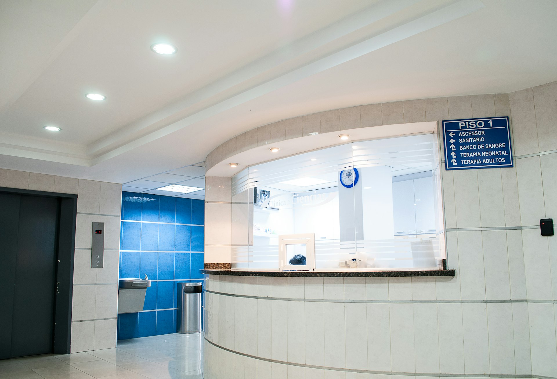 A hospital reception desk and corridor